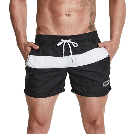 a sexy man in black Men’s Block Party Volley Swim Short – pridevoyageshop.com – gay men’s sexy swim briefs, trunks, board shorts, and bikinis