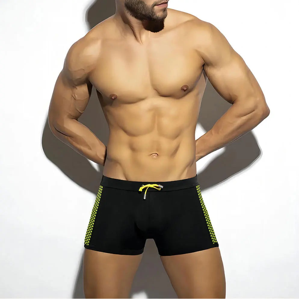a sexy man in black Men’s Circuit Spark Low Rise Swim Trunks - pridevoyageshop.com - gay men’s sexy swim briefs, trunks, board shorts, and bikinis