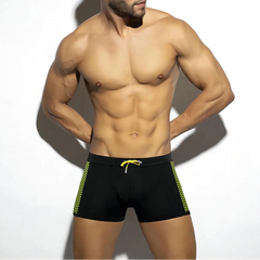 a sexy man in black Men’s Circuit Spark Low Rise Swim Trunks - pridevoyageshop.com - gay men’s sexy swim briefs, trunks, board shorts, and bikinis