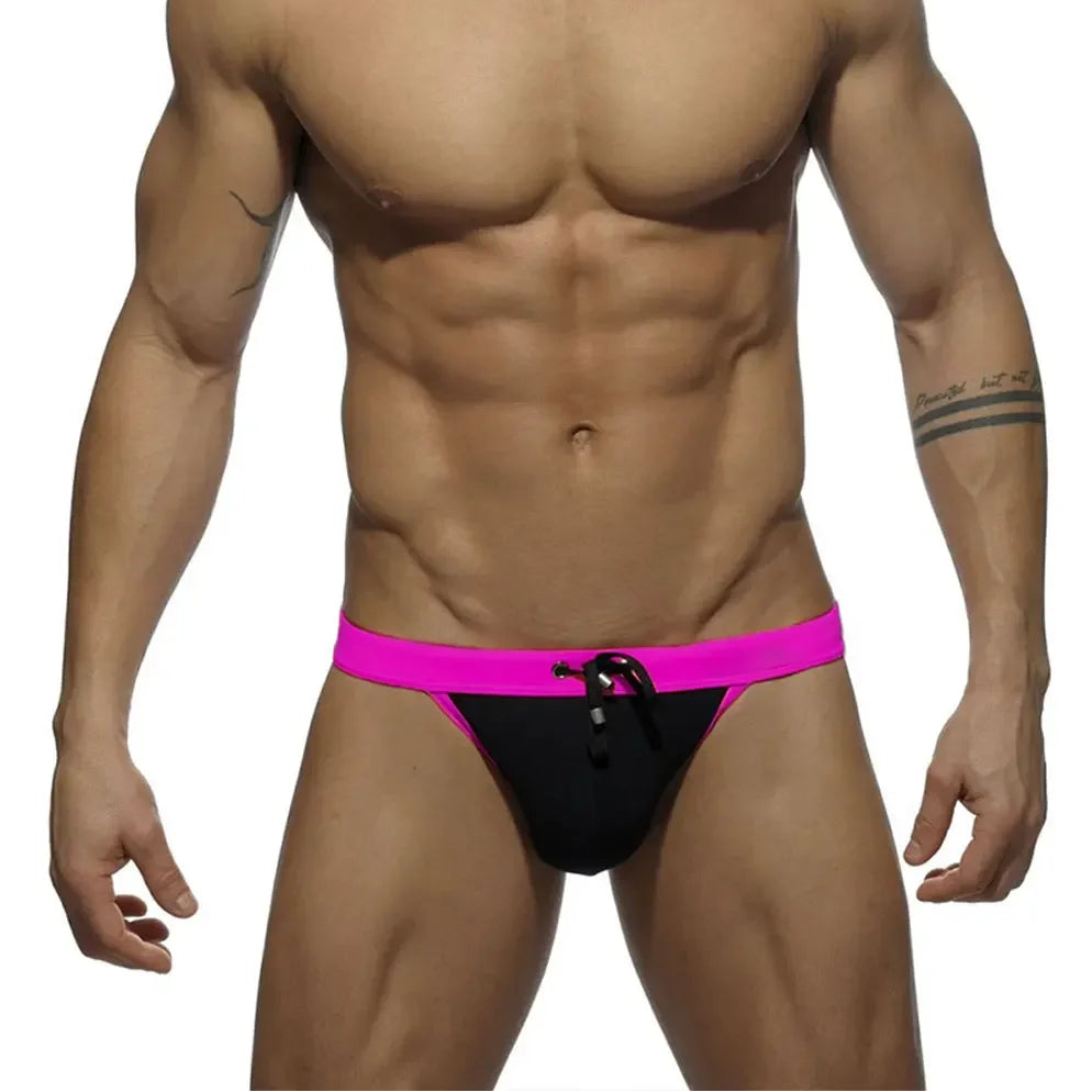 a sexy man in black Men’s Forbidden Fruit Bikini Swim Briefs - pridevoyageshop.com - gay men’s sexy swim briefs, trunks, board shorts, and bikinis