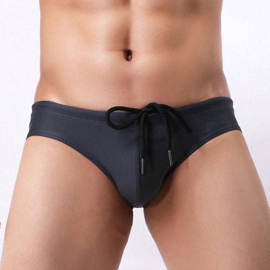a sexy man in black Men’s Package Patrol Swim Briefs - pridevoyageshop.com - gay men’s sexy swim briefs, trunks, board shorts, and bikinis