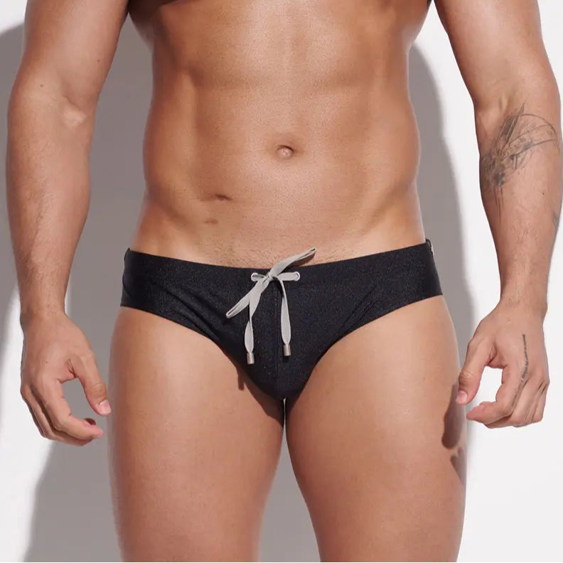 a sexy man in black Men’s Poolside Power Bottom Swim Briefs - pridevoyageshop.com - gay men’s sexy swim briefs, trunks, board shorts, and bikinis