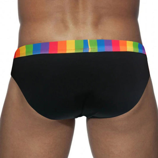 a sexy man in black Men’s Pride Patrol Rainbow Band Swim Briefs - pridevoyageshop.com - gay men’s sexy swim briefs, trunks, board shorts, and bikinis