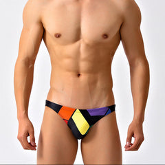 a sexy man in black Men’s Queer Grid Rainbow Pride Swim Briefs - pridevoyageshop.com - gay men’s sexy swim briefs, trunks, board shorts, and bikinis