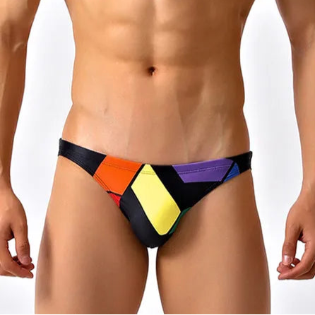 a sexy man in black Men’s Queer Grid Rainbow Pride Swim Briefs - pridevoyageshop.com - gay men’s sexy swim briefs, trunks, board shorts, and bikinis