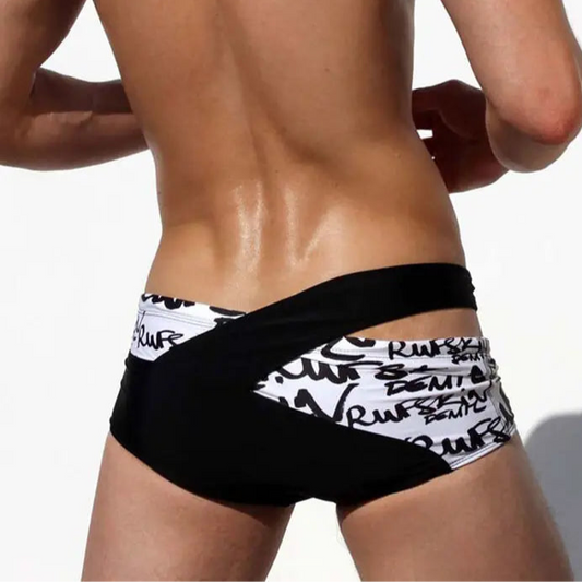 a sexy man in black Men’s Rebel Crossfire Low Rise Swim Briefs - pridevoyageshop.com - gay men’s sexy swim briefs, trunks, board shorts, and bikinis