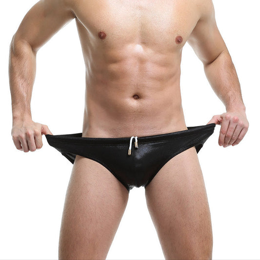 a sexy man in black Men’s Slay the Shine Shiny Swim Briefs - pridevoyageshop.com - gay men’s sexy swim briefs, trunks, board shorts, and bikinis