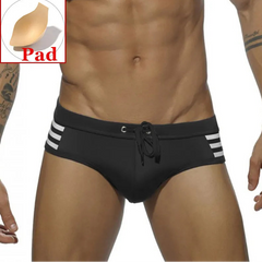 a sexy man in black Men’s Striped Stallion Low Rise Swim Briefs with pad - pridevoyageshop.com - gay men’s sexy swim briefs, trunks, board shorts, and bikinis