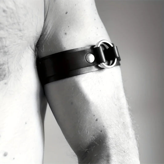 a sexy man in black Men’s The Punctuation Straps Armbands – pridevoyageshop.com – gay men’s harness, lingerie and fetish wear