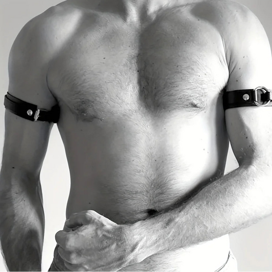 a sexy man in black Men’s The Punctuation Straps Armbands – pridevoyageshop.com – gay men’s harness, lingerie and fetish wear