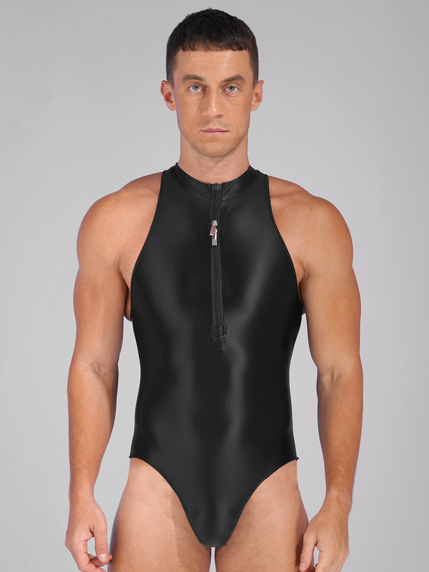 a sexy man in black Riptide Zip Racer Leotard with front zip, sculpted torso and sleek sporty cut – pridevoyageshop.com – gay men’s harness, lingerie and fetish wear