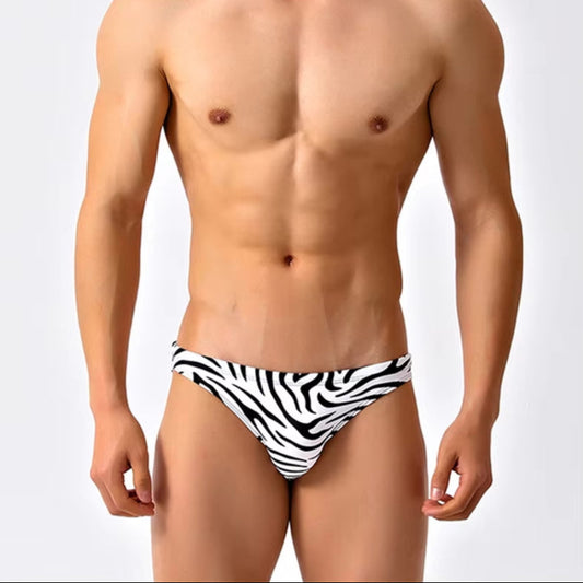 a sexy man in black striped Men’s Wild Streak Swim Briefs - pridevoyageshop.com - gay men’s sexy swim briefs, trunks, board shorts, and bikinis