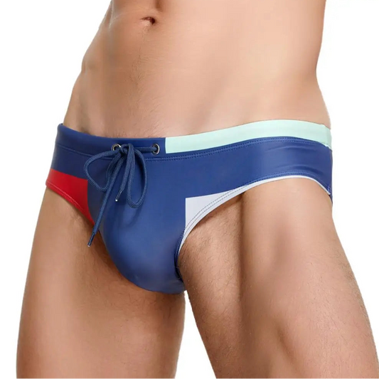 a sexy man in blue Men’s Colorblock Bait Swim Briefs - pridevoyageshop.com - gay men’s sexy swim briefs, trunks, board shorts, and bikinis