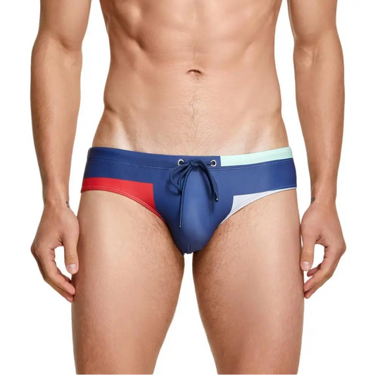 a sexy man in blue Men’s Colorblock Bait Swim Briefs - pridevoyageshop.com - gay men’s sexy swim briefs, trunks, board shorts, and bikinis