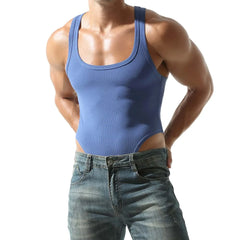 a sexy man in blue Submission Rib Thong Bodysuit – pridevoyageshop.com – gay men’s harness, lingerie and fetish wear