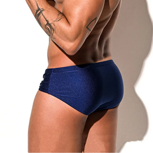 a sexy man in dark blue Desmiit Men’s Pouch Devil Low Rise Swim Briefs - pridevoyageshop.com - gay men’s sexy swim briefs, trunks, board shorts, and bikinis