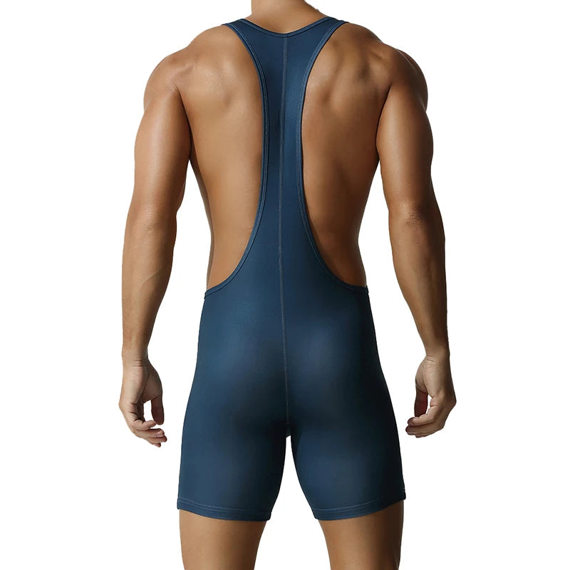 a sexy man in dark blue Men’s First-String Shield Singlet – pridevoyageshop.com – gay men’s harness, lingerie and fetish wear