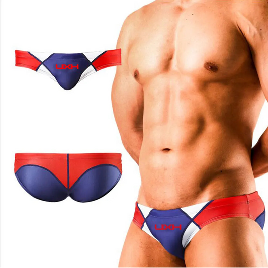 a sexy man in dark blue Men’s Halftime Hard-On Swim Briefs - pridevoyageshop.com - gay men’s sexy swim briefs, trunks, board shorts, and bikinis