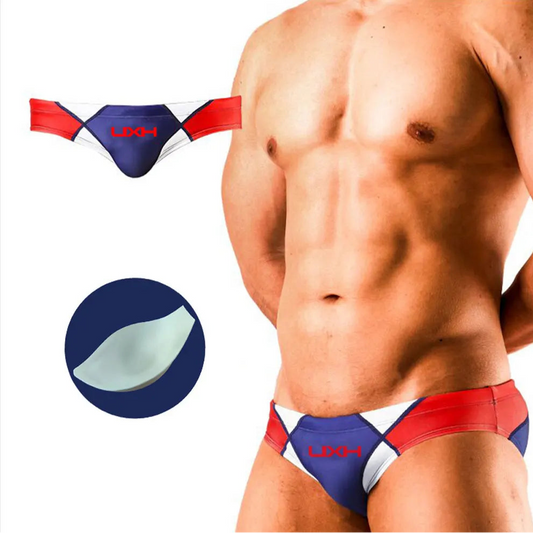 a sexy man in dark blue Men’s Halftime Hard-On Swim Briefs with pad - pridevoyageshop.com - gay men’s sexy swim briefs, trunks, board shorts, and bikinis