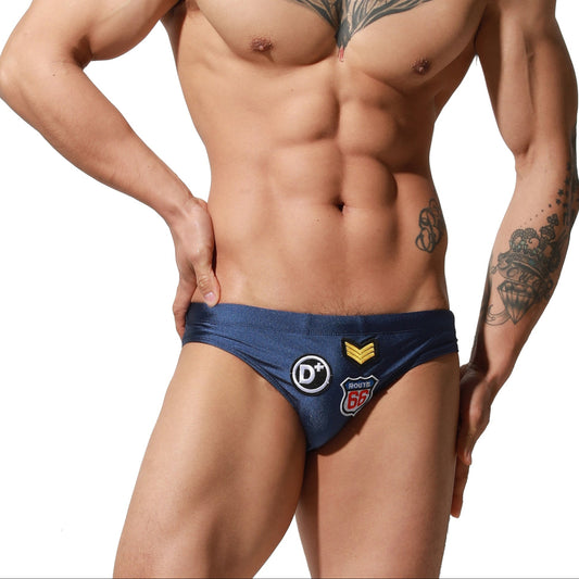 a sexy man in dark blue Men’s Officer on Duty Low Rise Swim Briefs - pridevoyageshop.com - gay men’s sexy swim briefs, trunks, board shorts, and bikinis