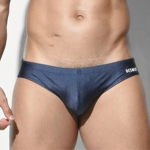 a sexy man in dark blue Men’s SleekFlex Bulge-Boost Swim Briefs - pridevoyageshop.com - gay men’s sexy swim briefs, trunks, board shorts, and bikinis