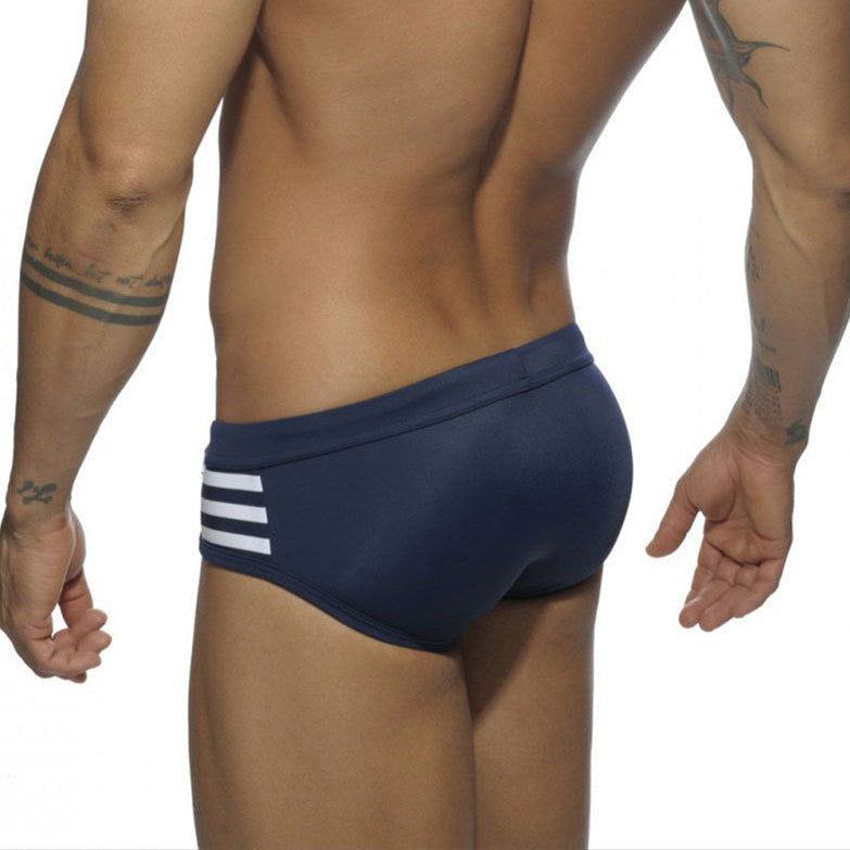 a sexy man in dark blue Men’s Striped Stallion Low Rise Swim Briefs - pridevoyageshop.com - gay men’s sexy swim briefs, trunks, board shorts, and bikinis