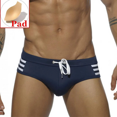 a sexy man in dark blue Men’s Striped Stallion Low Rise Swim Briefs with pad - pridevoyageshop.com - gay men’s sexy swim briefs, trunks, board shorts, and bikinis