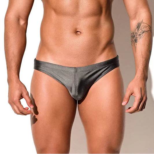 a sexy man in gray Desmiit Men’s Trophy Cut Swim Briefs - pridevoyageshop.com - gay men’s sexy swim briefs, trunks, board shorts, and bikinis