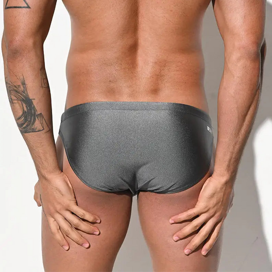 a sexy man in gray Desmiit Men’s Trophy Cut Swim Briefs - pridevoyageshop.com - gay men’s sexy swim briefs, trunks, board shorts, and bikinis