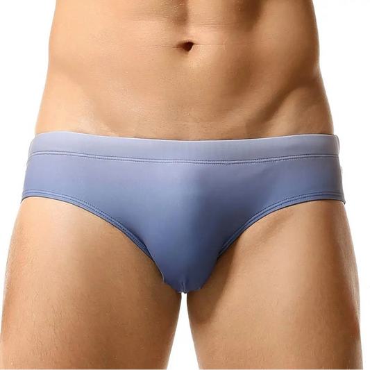 a sexy man in gray Men’s Candy Cove Swim Briefs - pridevoyageshop.com - gay men’s sexy swim briefs, trunks, board shorts, and bikinis