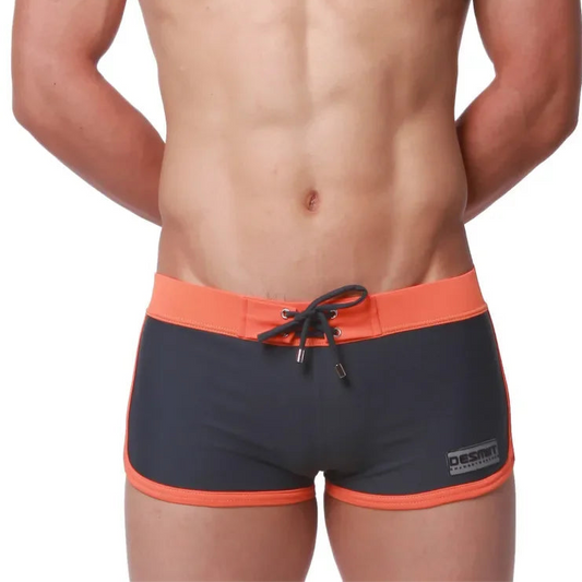 a sexy man in gray Men’s Circuit Beat Low Rise Swim Trunks - pridevoyageshop.com - gay men’s sexy swim briefs, trunks, board shorts, and bikinis