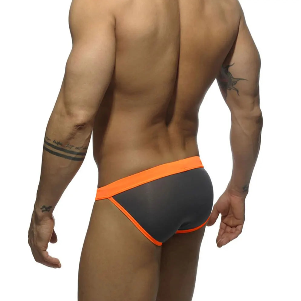 a sexy man in gray Men’s Forbidden Fruit Bikini Swim Briefs - pridevoyageshop.com - gay men’s sexy swim briefs, trunks, board shorts, and bikinis