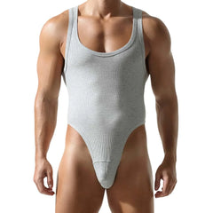 a sexy man in gray Submission Rib Thong Bodysuit – pridevoyageshop.com – gay men’s harness, lingerie and fetish wear