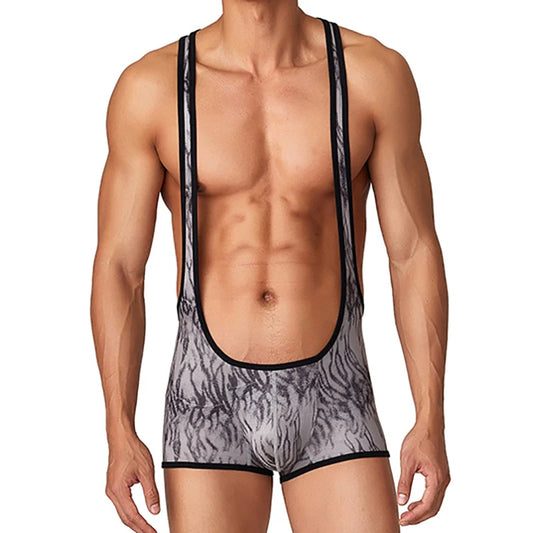 a sexy man in gray The Predator Singlet – pridevoyageshop.com – gay men’s harness, lingerie and fetish wear