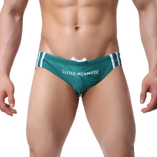 a sexy man in green Men’s Jock Strut Swim Briefs - pridevoyageshop.com - gay men’s sexy swim briefs, trunks, board shorts, and bikinis