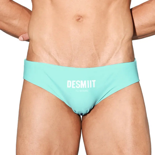 a sexy man in light blue Desmiit Men’s Brunch-Ready Bikini Swim Briefs - pridevoyageshop.com - gay men’s sexy swim briefs, trunks, board shorts, and bikinis