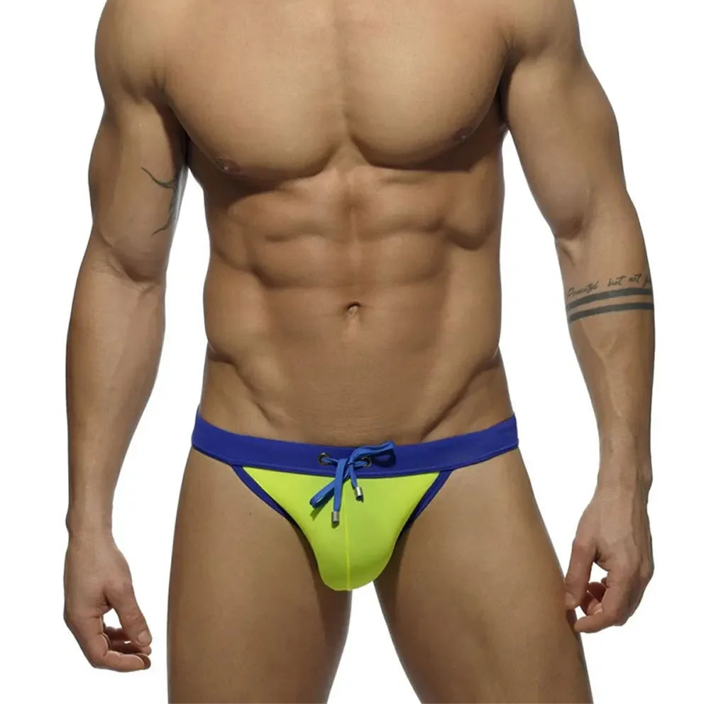 a sexy man in light green Men’s Forbidden Fruit Bikini Swim Briefs - pridevoyageshop.com - gay men’s sexy swim briefs, trunks, board shorts, and bikinis