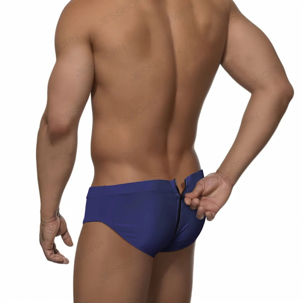 a sexy man in navy Men's Unzip Me Daddy Swim Briefs - pridevoyageshop.com - gay men’s sexy swim briefs, trunks, board shorts, and bikinis