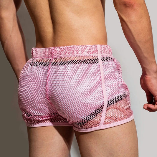 a sexy man in pink DM Men’s Trade Bait See-Thru Mesh Shorts – pridevoyageshop.com – gay men’s sexy swim briefs, trunks, board shorts, and bikinis