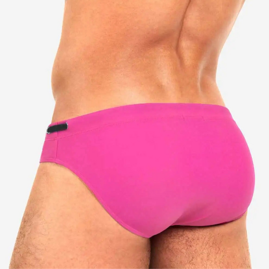 a sexy man in pink Men’s Beach Brat Swim Briefs - pridevoyageshop.com - gay men’s sexy swim briefs, trunks, board shorts, and bikinis