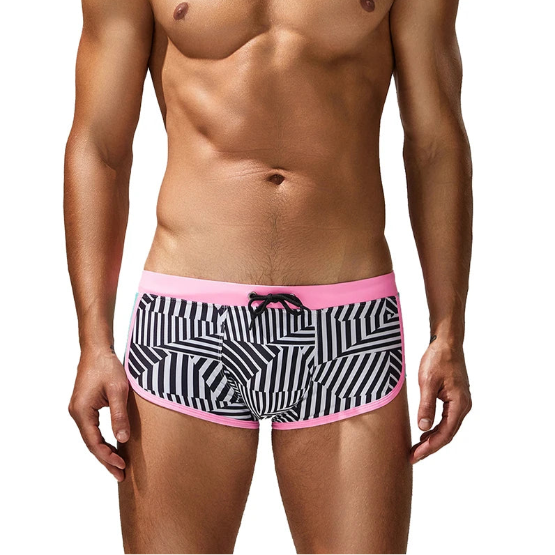 a sexy man in pink side SEOBEAN Men’s Obey the Stripe Low Rise Swim Trunks – pridevoyageshop.com – gay men’s sexy swim briefs, trunks, board shorts, and bikinis