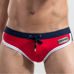 a sexy man in red Desmiit Men’s Colorblock Speed Bulge Swim Briefs - pridevoyageshop.com - gay men’s sexy swim briefs, trunks, board shorts, and bikinis