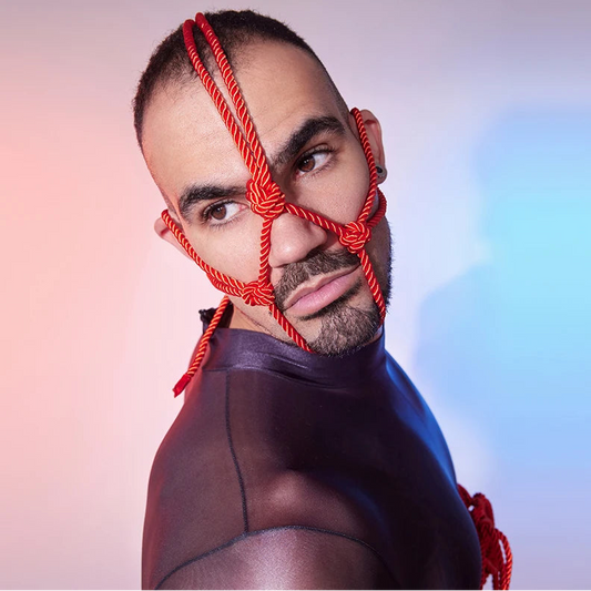 a sexy man in red Men’s Kinbaku Head Harness – pridevoyageshop.com – gay men’s harness, lingerie and fetish wear
