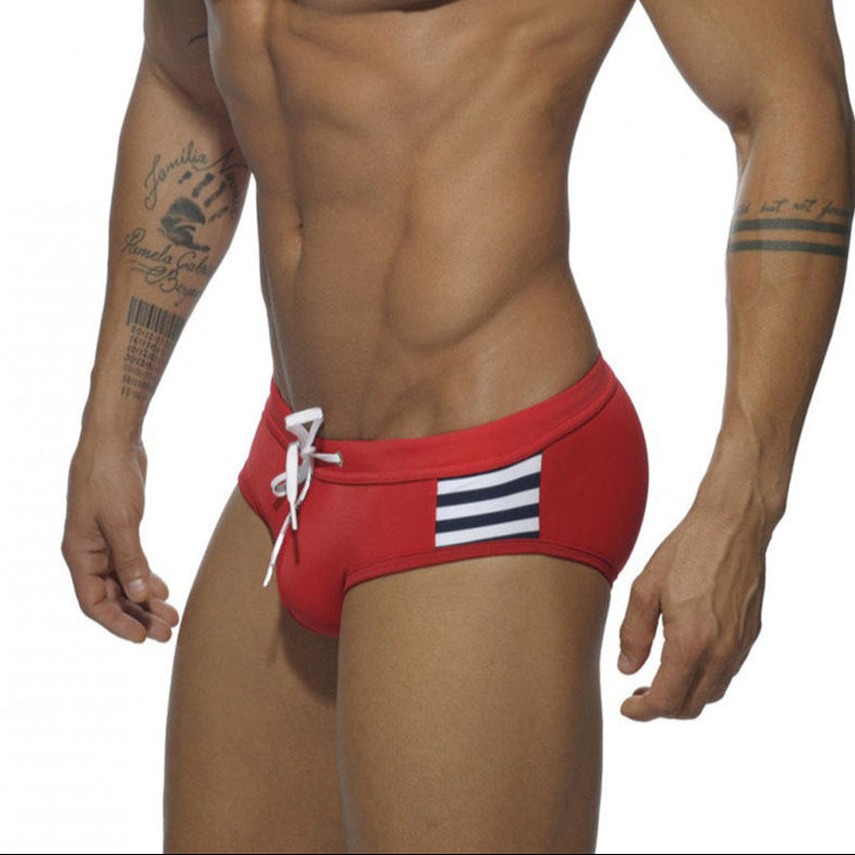 a sexy man in red Men’s Striped Stallion Low Rise Swim Briefs - pridevoyageshop.com - gay men’s sexy swim briefs, trunks, board shorts, and bikinis
