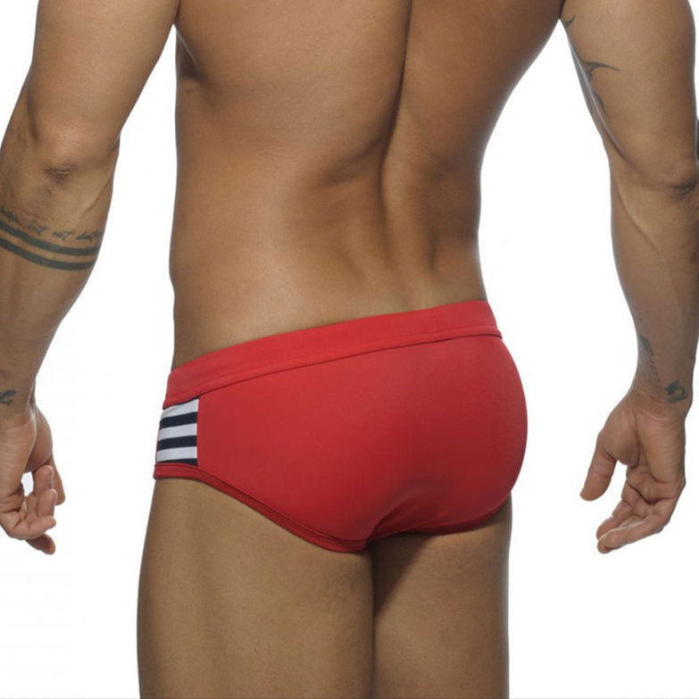 a sexy man in red Men’s Striped Stallion Low Rise Swim Briefs - pridevoyageshop.com - gay men’s sexy swim briefs, trunks, board shorts, and bikinis