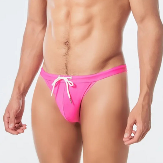 a sexy man in rose red Men’s Show Pony Drawstring Swim Briefs - pridevoyageshop.com - gay men’s sexy swim briefs, trunks, board shorts, and bikinis