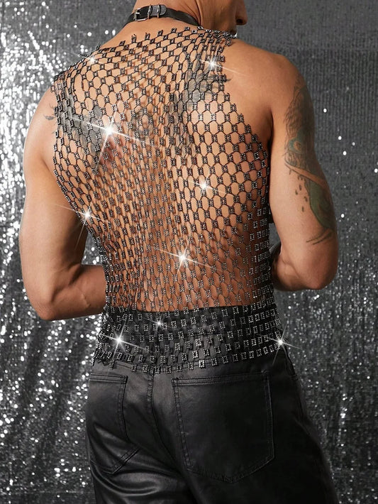 a sexy man in silver coinmail tank with metal discs draping over chest, showing sculpted torso and chain-style shimmer – pridevoyageshop.com – gay men’s harness, lingerie and fetish wear