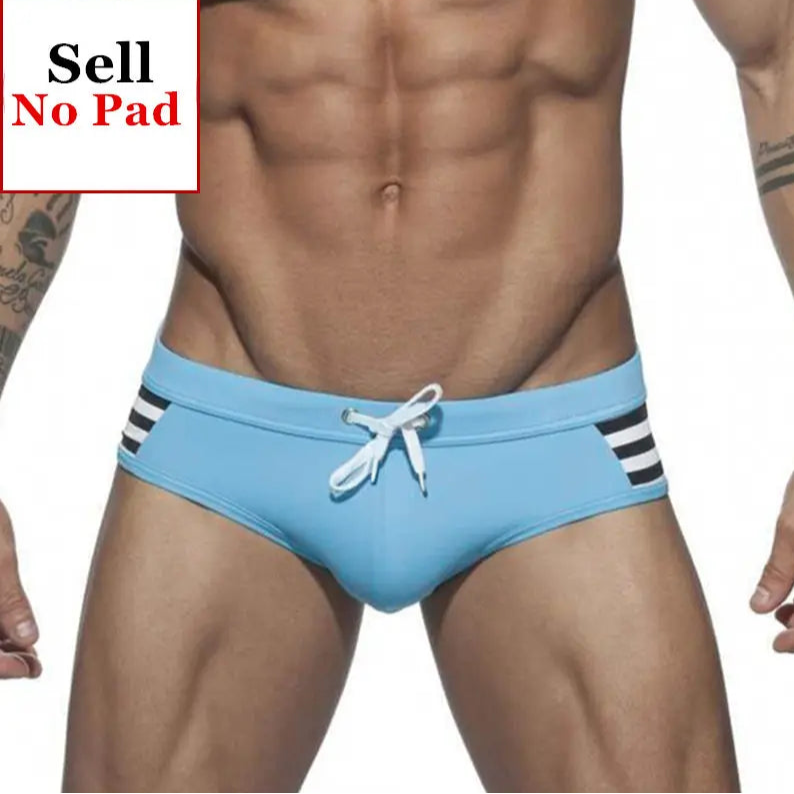 a sexy man in sky blue Men’s Striped Stallion Low Rise Swim Briefs - pridevoyageshop.com - gay men’s sexy swim briefs, trunks, board shorts, and bikinis
