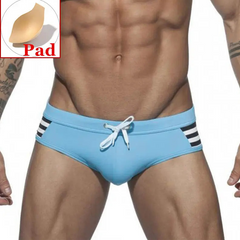 a sexy man in sky blue Men’s Striped Stallion Low Rise Swim Briefs with pad - pridevoyageshop.com - gay men’s sexy swim briefs, trunks, board shorts, and bikinis