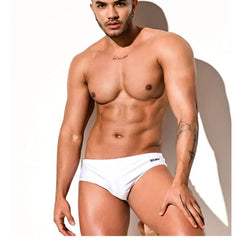 a sexy man in white Desmiit Men’s Pouch Devil Low Rise Swim Briefs - pridevoyageshop.com - gay men’s sexy swim briefs, trunks, board shorts, and bikinis